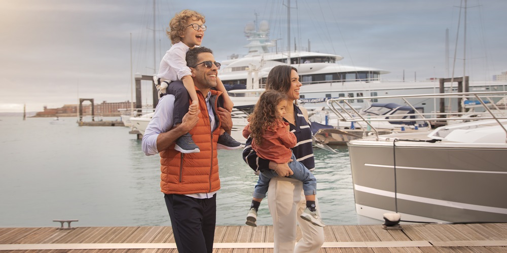 Family walking along the marina at Gunwharf Quays